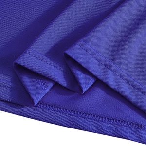 Macro shot of blue piqué fabric texture and double-needle stitching on the polo shirt hem