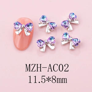 Detail of 3D gradient blue and purple bow nail charm with silver base on mannequin nail