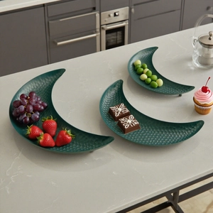 Three-piece set of dark green crescent moon trays with elegant hammered metal texture
