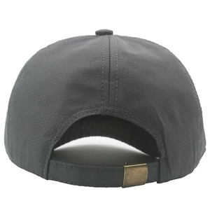 Detail of dark grey baseball cap featuring honeycomb texture and bronze metal buckle