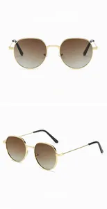 Detail view of retro gold metal sunglasses with deep brown gradient round lenses