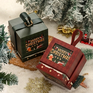 Detail of red and green Christmas gift boxes with handles and Merry Christmas prints