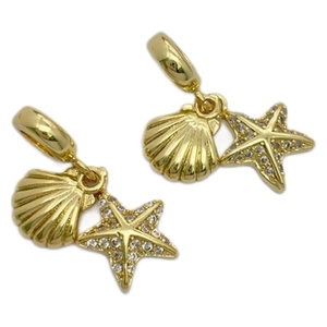 Golden starfish and shell pendant with white zircon stones on a clean white background