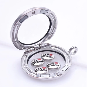 Close-up of silver floating charm locket open with Nana heart charms inside