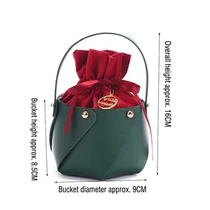 Christmas green leather gift box with red drawstring bag and Merry Christmas metal tag