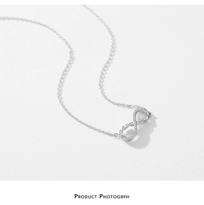 Macro shot of S925 sterling silver Mobius necklace with sparkling pavé cubic zirconia
