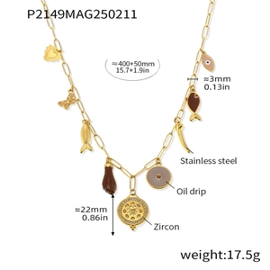 Detail of gold stainless steel necklace with fish, butterfly and evil eye charms