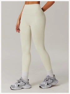 Detail view of high waist yoga leggings with side pockets in breathable cream fabric