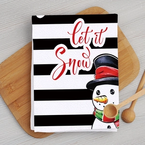 Microfiber Christmas kitchen towel with let it snow text and snowman on a wood board