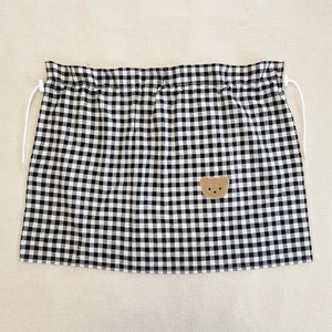 Detail of checkered car sunshade curtain with cute brown bear embroidery and drawstring