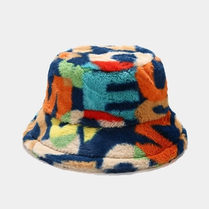 Detailed close-up showing soft plush faux fur texture and colorful patchwork bucket hat