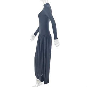 Detail view of the high neck design and ruched waist on a slim fit navy maxi dress