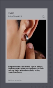 Close-up of polished silver steel hoop earring with engraved lettering on model