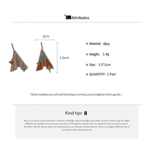 Détails des boucles d'oreilles avion en papier avec émail coloré et accents d'étoile