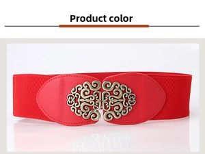 Detail of red elastic waist belt featuring an antique bronze hollow floral buckle