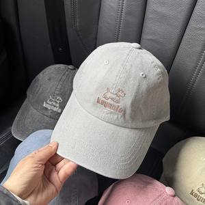 Close-up of diverse colors washed canvas baseball caps with premium dog embroidery detail