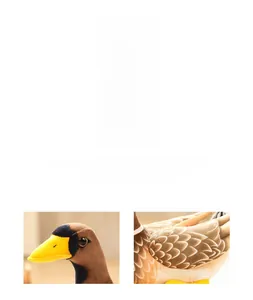 Detailed view of the soft plush feathers and tight stitching on the couple duck dolls