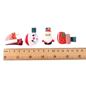 Set di 4 mollette natalizie in resina con Babbo Natale e motivi festivi per bambini