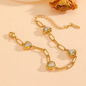 Luxurious gold-plated stainless steel paperclip bracelet with four heart-shaped zircon charms