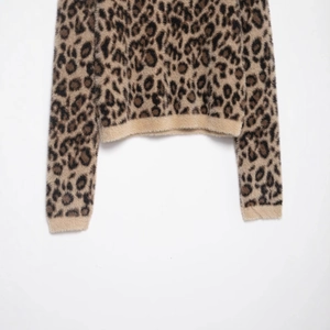 Cozy leopard print long sleeve sweater in faux fur mohair knit with ribbed cuffs
