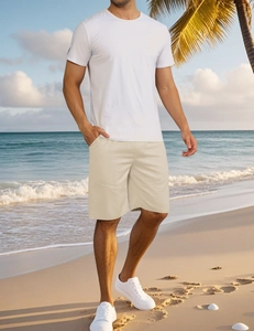 Close-up of beige summer casual sports shorts for men shown on beach background