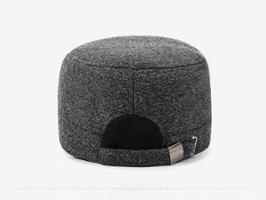 Detail of grey wool flat cap with adjustable metal buckle and elastic back strap