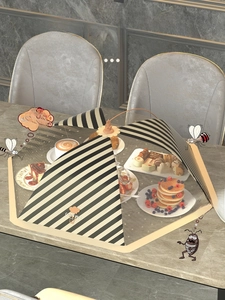 Close-up of foldable mesh food cover with 360-degree protection on marble table