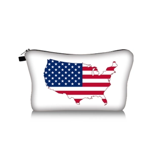 Macro shot of portable makeup bag with US map and flag print and black zipper detail