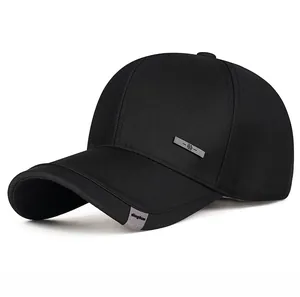 Close-up of black business baseball cap featuring a metal side plate and cloth label