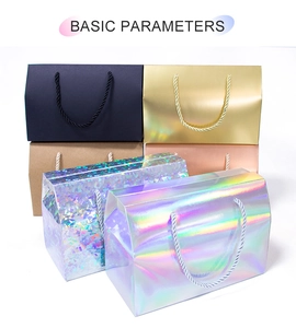 Various gift bags in matte black, gold, and holographic laser finishes with rope handles