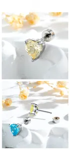 Macro detail of heart-cut gems in blue and yellow with screw back ear studs