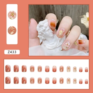 Faux ongles fleurs orange coucher de soleil avec texture marbre et perles, kit 24pcs