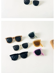 Flat lay of colorful foldable children's sunglasses in diverse vibrant pastel colors