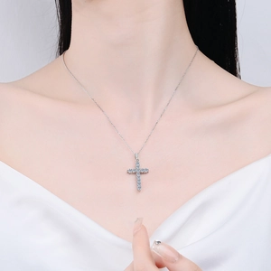 Elegant s925 sterling silver cross pendant necklace with moissanite on female model