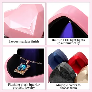 Heart-shaped jewelry box with built-in LED light and premium velvet lining for rings