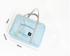 Detailed size chart showing 44x30x13.5cm dimensions of the light blue travel bag