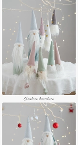Close-up of Morandi-toned Christmas gnomes with knit hats and faux fur beards detail