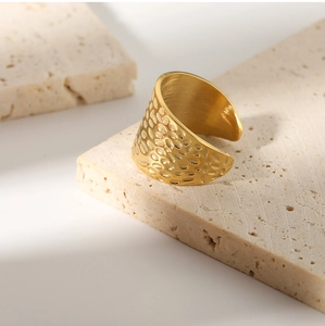 Detailed macro shot of the hammered texture on this adjustable gold stainless steel ring