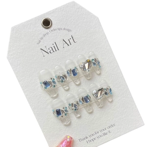 Handmade Snow White press-on nails with blue crystals and heart-shaped gemstone