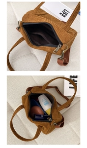 Detailed top view of brown corduroy Boston bag interior showing spacious lining and inner pocket