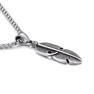 Vintage hollow feather pendant in stainless steel with silver finish on a box chain
