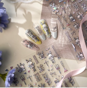 Close-up of Gothic Lolita rabbit and cross nail stickers with laser glitter effect