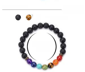 Detail view of 8mm lava stone chakra bracelet with seven colored energy beads