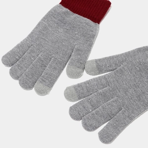 Detail of grey knitted gloves with red ribbed cuffs and touchscreen sensitive fingertips