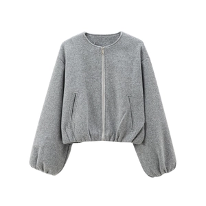 Detail of grey cropped bomber jacket featuring soft knit texture and puffy lantern sleeves