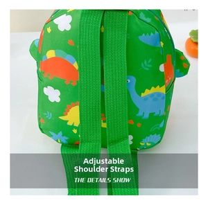 Close-up of adjustable green shoulder straps on a cute dinosaur pattern kids backpack