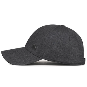 Dark grey hard-top business baseball cap with metallic M logo and curved visor