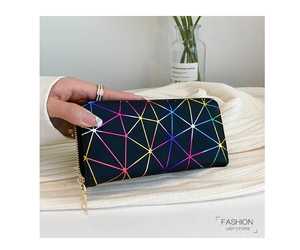 Close-up of long zip wallet with colorful geometric lines held against a soft knit background