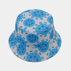 Grey bucket hat with blue evil eye mandala pattern shown from a top-down view