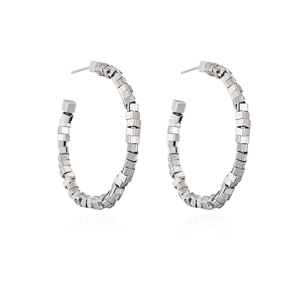 Macro detail of silver geometric square chain hoop earrings with a polished metal finish